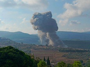 Israel stages airstrikes on Lebanon as Hezbollah also launches attack