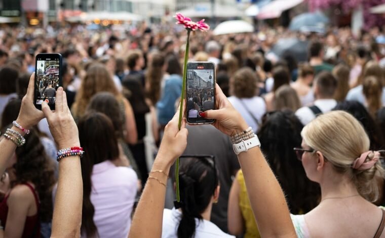 Taylor Swift fans gather in Vienna’s streets to sing her songs after canceled concerts