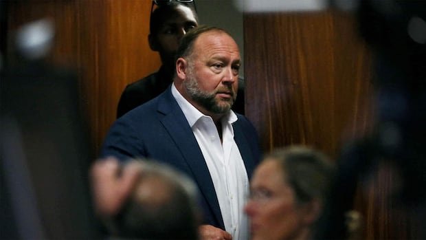 The Onion buys conspiracy site Infowars at auction with help from Sandy Hook families | CBC News